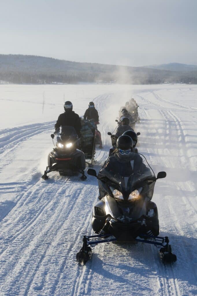Group of people on snowmobiles, Jukkasjarvi, Sweden